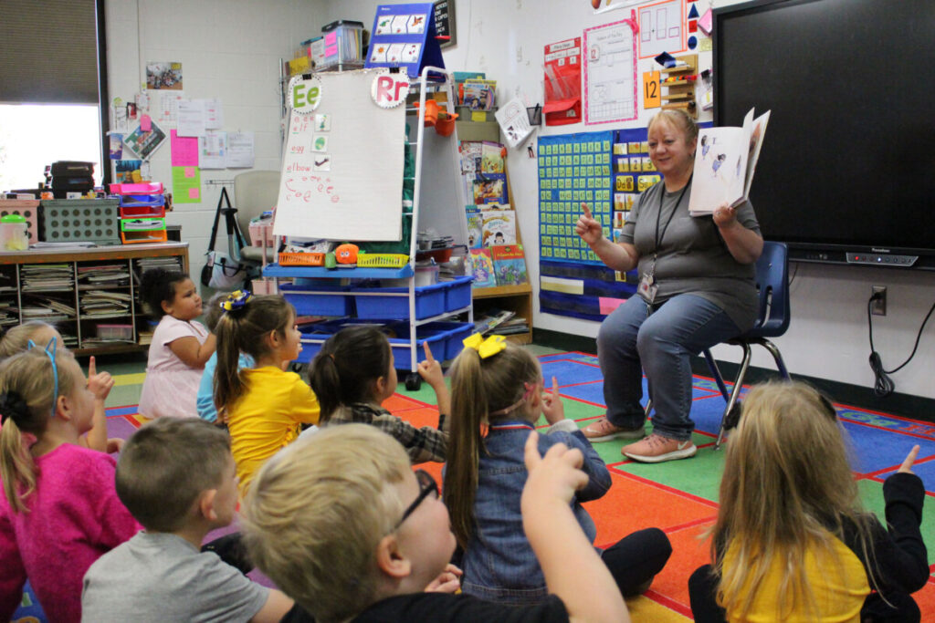 Marshall County Schools Literacy Facilitator Jeannie Blake reads to kindergarten students at McNinch Primary School during the annual Read for the Record Day.