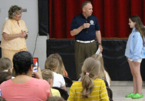 Pictured from left: Glen Dale Elementary Principal Kimberly Cain, Gabby Dantrassy and WV State Treasurer Regional Representative Tim Hooper.