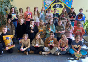 The Hilltop Elementary Kindness Crew is pictured with the items they collected of the local animal shelter.