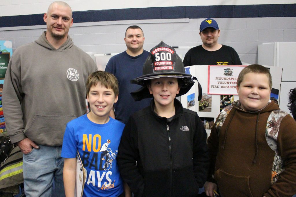 Moundsville volunteer firefighters talk with students