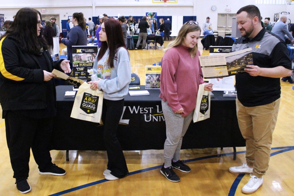 Pictured from left: WLU Assistant Director of Admissions Operations Michelle Panepucci talks to CHS senior Chloe Wheeler about the programs that are offered by the Hilltoppers while CHS senior Ava Ross hears about the financial aid process from WLU Admissions Counselor Aaron Kuhn.