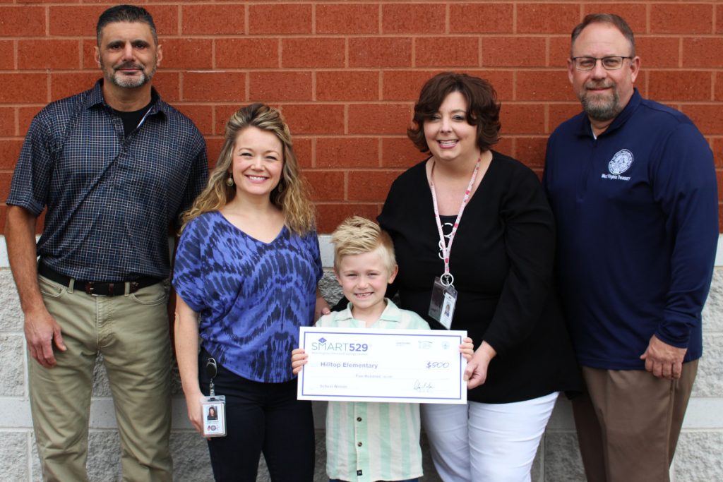 Pictured from left: Dino Figaretti (WV State Treasury Office local government specialist), Megan Roberts (Ryker’s mother), Ryker Roberts, Cindy McCutcheon (Hilltop Elementary principal) and Tim Hooper (WV State Treasury Office local government specialist).
