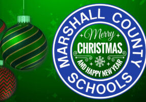 Three red and green Christmas bulbs are on the left side of this video with a white Marshall County Schools logo on the right. Merry Christmas and Happy New Year appear in the middle of the county logo.