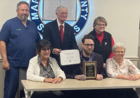 Jared Ulrich was honored at the December BOE meeting for his accolade. Seated from left: MCS BOE member Lori Kestner, Jared Ulrich and MCS BOE member Brenda Coffield. Standing from left: BOE member Dr. Duane Miller, MCS BOE President John Miller and BOE Vice-President Christie Robison.