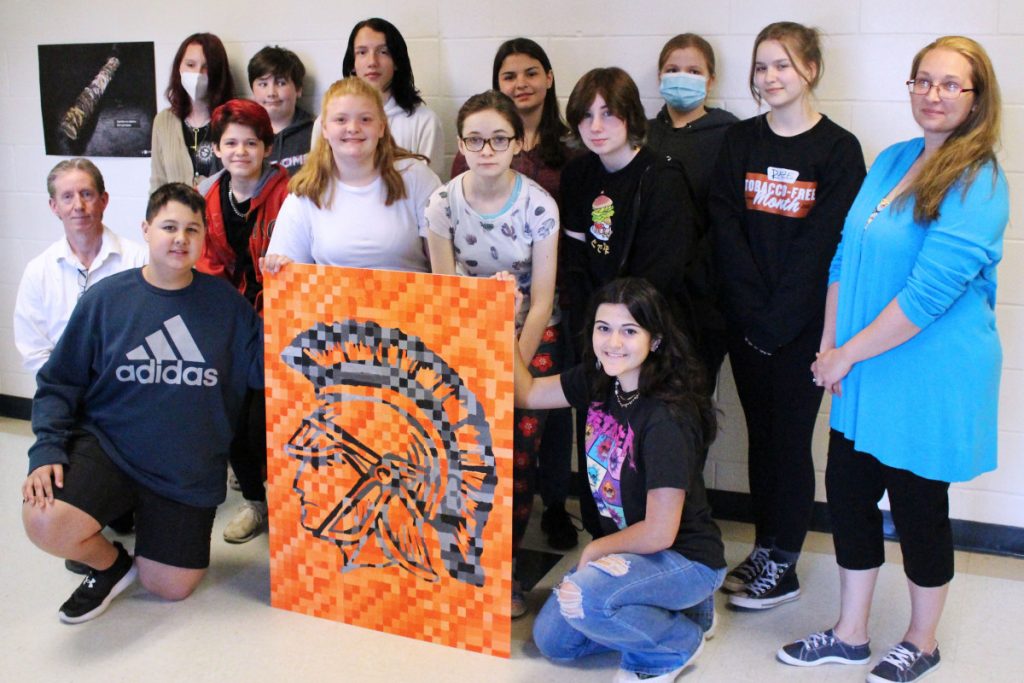 Pictured from left kneeling: Camden Hoyt and Riley Polsinelli. Second row from left: Stifle Fine Arts artist Brad Johnson, Khloie Burton, Jayden Blake, Gwen Brown, Abbie Allen and teacher Tabetha Morgan. Back row from left: Lexi Lilley, Owen Myers, Chevy Large, Sophie Crumm, Zooey Toothman and Cheyanne Foster.