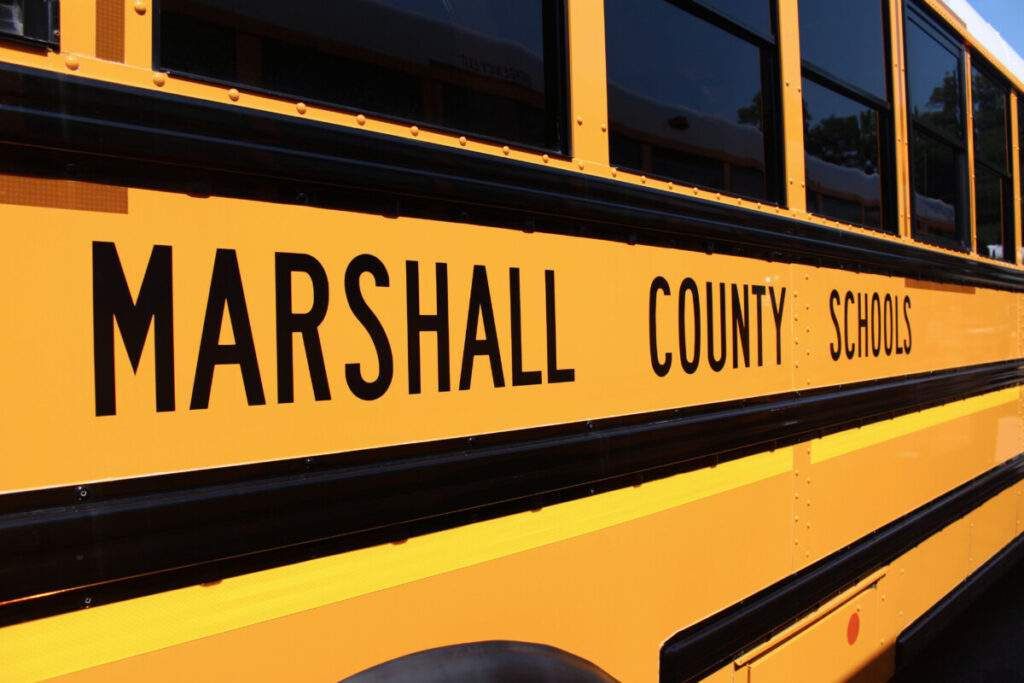 Side view of yellow Marshall County Schools bus.