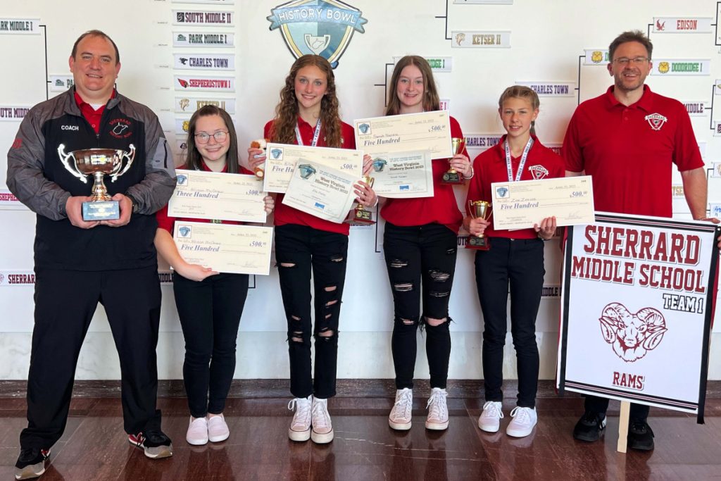 Pictured from left: SMS History Bowl coach Dan Gatts, Allison McGraw, Ella Finley, Sarah Naome, Zoe Zervos and SMS History Bowl coach Jeff Stephens.