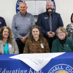 Pictured from left front row: MCS Assistant Superintendent Karen Klamut, MCS Superintendent Dr. Shelby Haines and MCS BOE Vice-President Christie Robison. Back row from left: Marshall County AFT President Josh Gary, Marshall County Commission President Mike Ferro, MC Chamber Executive Director Scott Reager and MCEA President Stephanie Brown.