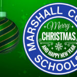 Three red and green Christmas bulbs are on the left side of this video with a white Marshall County Schools logo on the right. Merry Christmas and Happy New Year appear in the middle of the county logo.