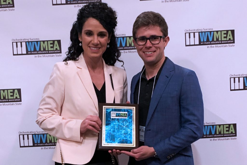 Pictured from left: West Virginia Society for General Music President Kathy Fox and Washington Lands Elementary Music teacher Eli Lambie, award recipient.